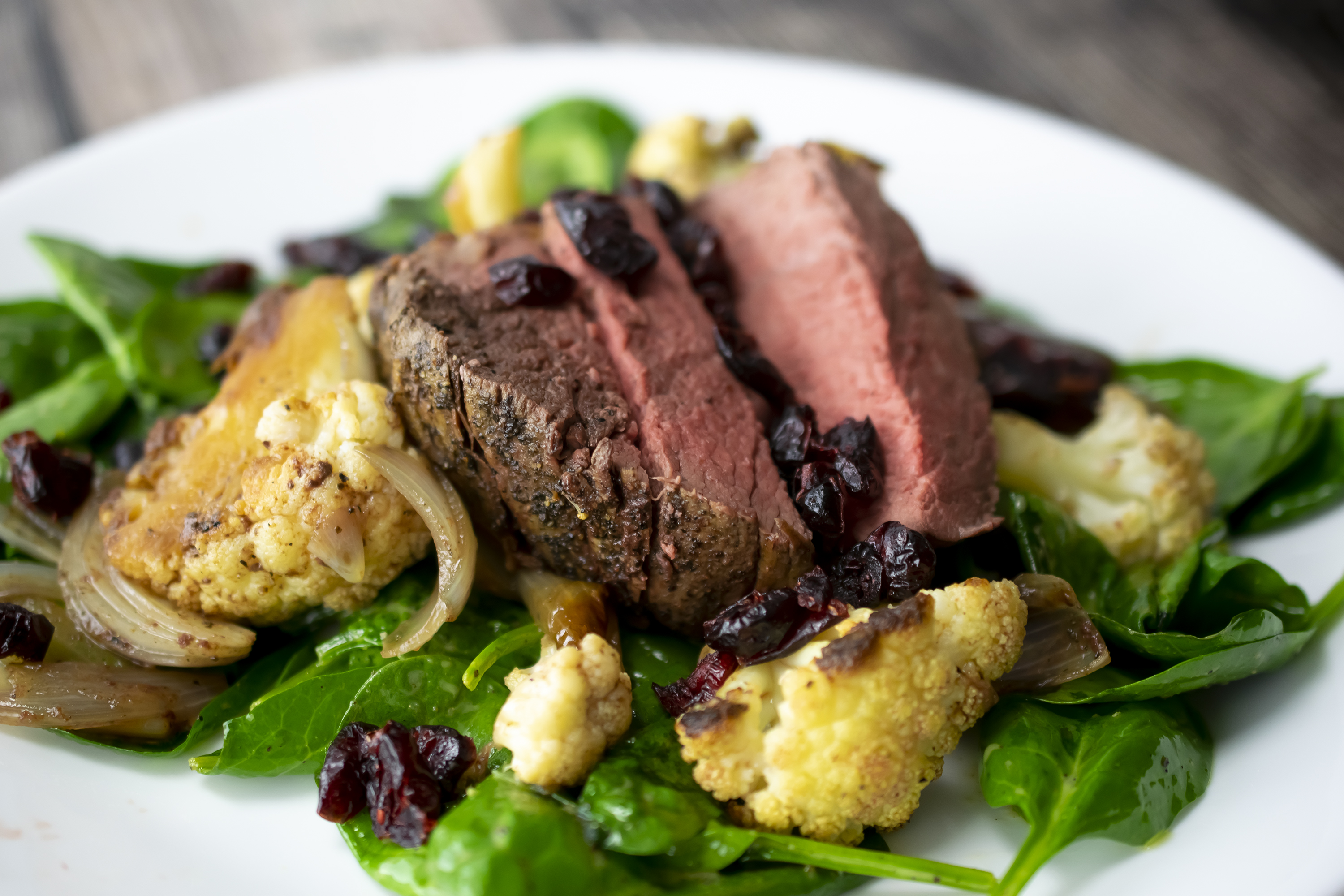 Beef Tenderloin with Roasted Cauliflower and Spinach Salad
