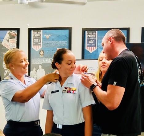 Cahill Family pinning Aisly as officer in Civil Air Patrol.jpg