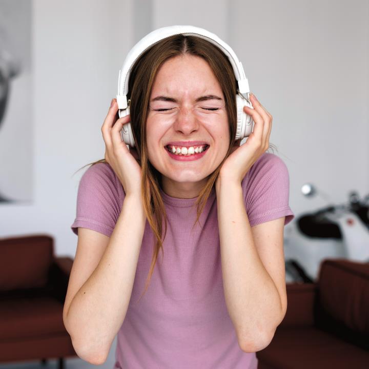 Hearing_woman-listening-loud-music-headphones.jpg