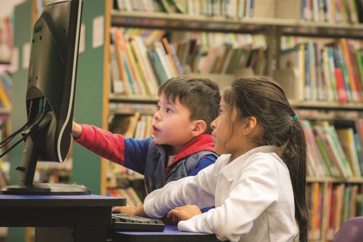 kids-using-a-computer-at-the-library-2021-10-12-21-19-34-utc.jpg